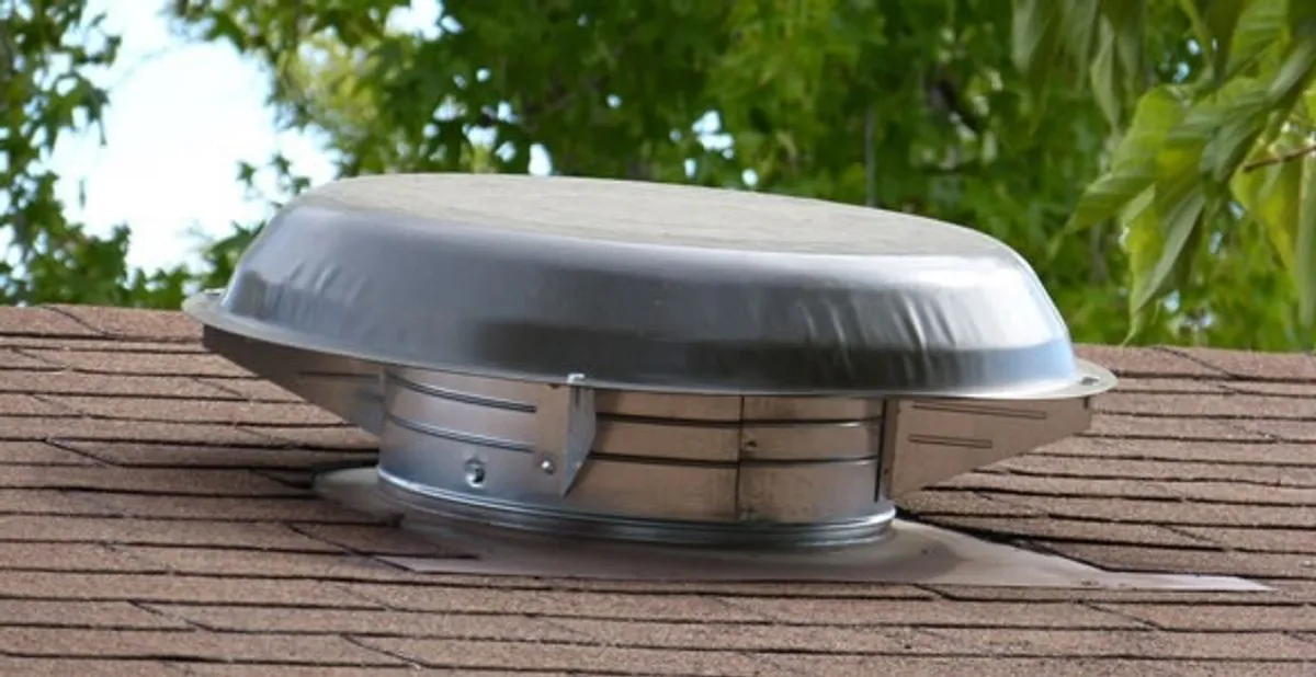 attic fan installation services with low-profile roof ventilation unit in Olathe, KS