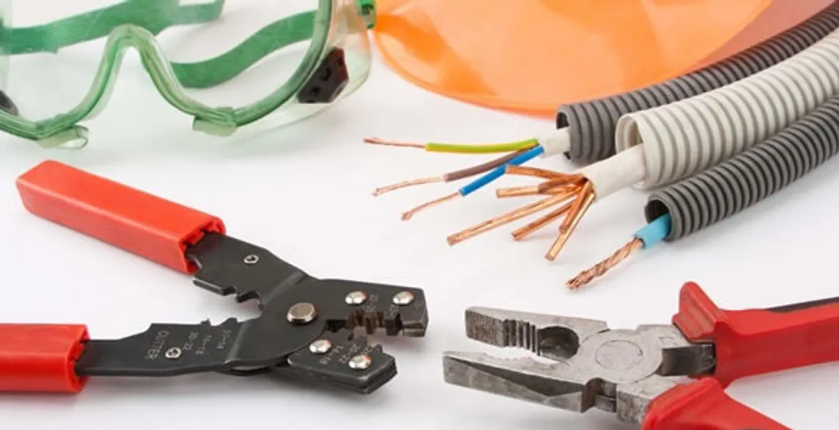 Electrical wiring repair with professional tools and safety equipment in Prairie Village, KS