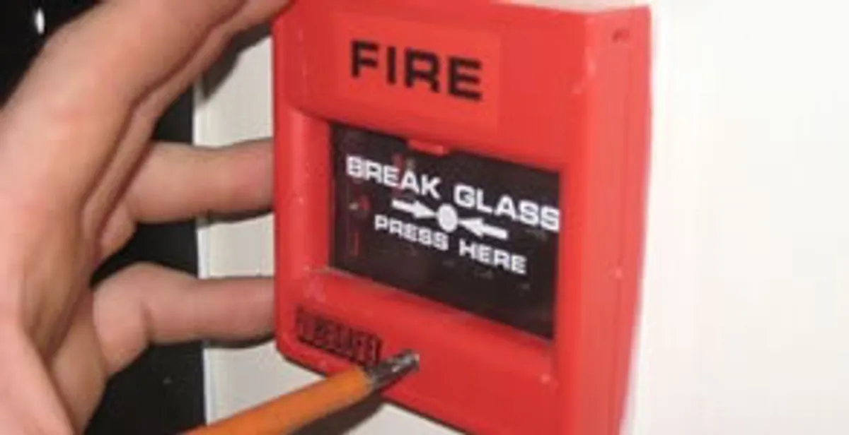 fire alarm installation service showing manual fire alarm pull station installed by licensed electricians in Olathe, KS