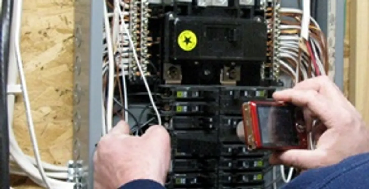 Home electrical inspection of circuit breaker panel by licensed electrician in Olathe, KS